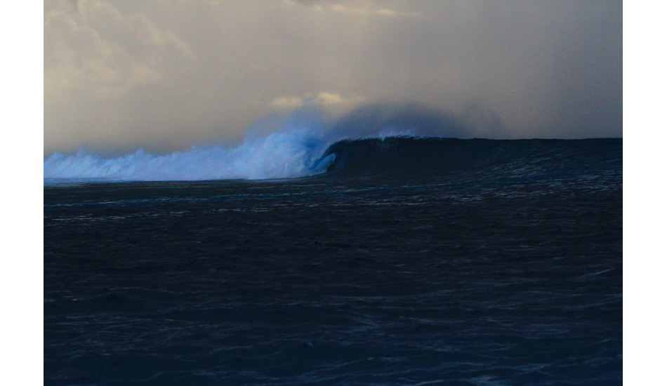 A bombing left rolls through at sunset. Photo: Jason Naudé