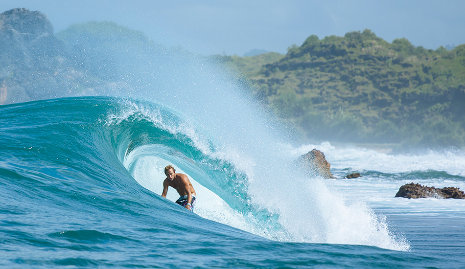 Peeking into the barrel from the channel at Pacitan, Java. Josh Kerr. Photo: <a href=\"https://www.reposarphoto.com\">Jason Reposar</a>