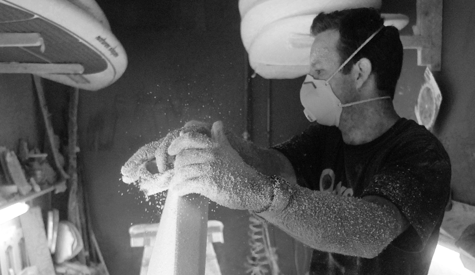 Local shaper Mike Becker of Nature\'s Shapes surfboards, carving away in the shaping bay. Photo: <a href=\"http://www.timelessride.com\">Jim Cook</a>