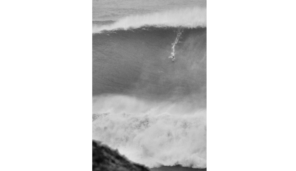 As I decided to take a tight shot, the biggest wave ever surfed turned up and Carlos Burle surfed it just after saving Maya from certain death. Photo: <a href= \"https://joaobracourt.com/\" target=_blank>Joao Bracourt.</a>