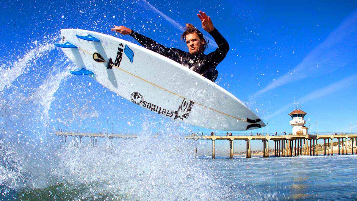Brett, the king of HB. Pier background, sick punt. Brett marches to his own drum so this to me was like finding a 4 leaf clover. Photo: <a href=\"https://aladdinsurfmag.net/\"> Foster </a>
