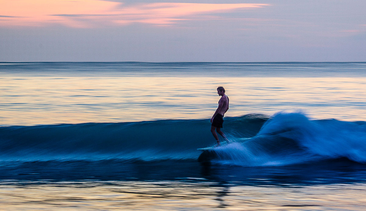 Pitstop Hill owner Paul Clark sliding on a single fin through his front yard. Photo: <a href=\"https://johnbarton.net.au/\">John Barton</a>