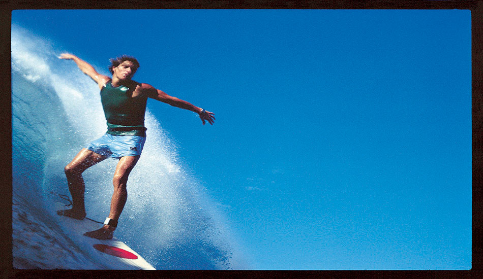 Shooting pictures with the little Nikonos water camera was something of a hit-and-miss affair. The early models had a 35 mm lens that meant you had to get very close to what was happening … otherwise it looked like it was the length of a football field away. You really had to swim, being on a surf mat or a board didn’t cut it. Wave knowledge and surfing experience were essential. I dropped one of the cameras and lost it, and then tethered its replacement to my wrist. I often simply held it out, pointed in what I hoped was the right direction, and pressed the shutter. This picture of Buzzy Kerbox at Haleiwa is an example of that. You probably wouldn’t try for the odd composition, but it’s a favorite image of mine.