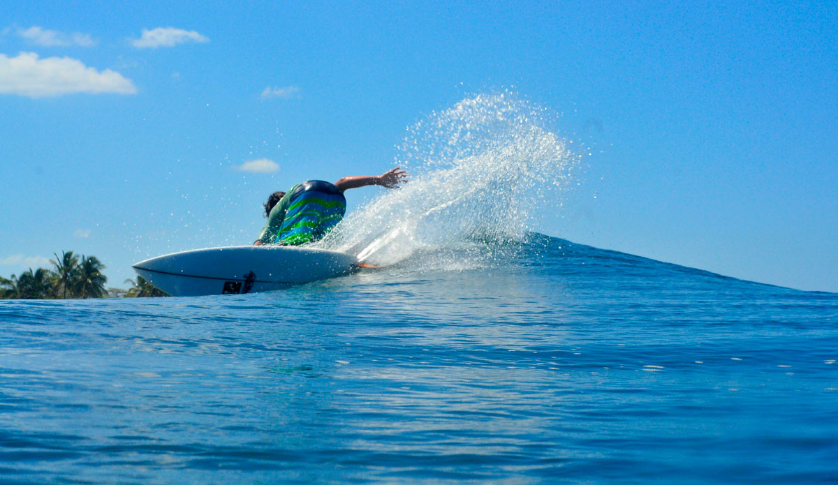 Mikey, mid-backside carve. Photo: <a href=\"https://jonathanwatsonphotography.com/#/page/home/\">Jonathan Watson</a>
