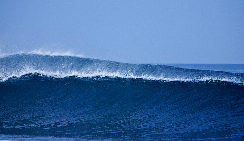 Perfect blue walls of water roll onto the reef in Fuerteventura. Photo: <a href=\"https://www.jordanweeks.com/\" target=_blank>Jordan Weeks</a>