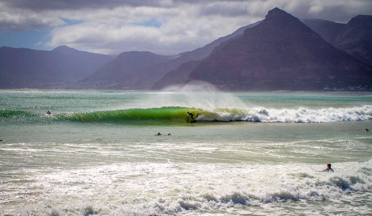 Matt Bromley gliding into a long beach drainer. Photo: <a href=\"https://craiglarsonimaging.com/\">Craig Larson</a>