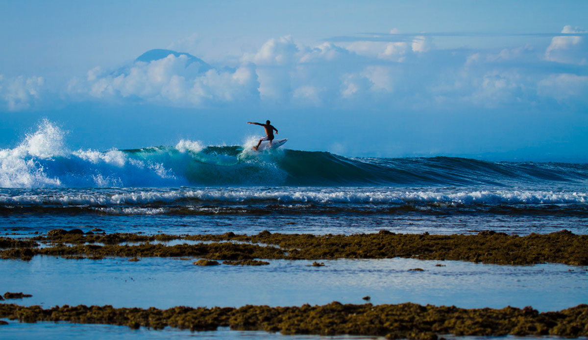 Mt. Gunga above the clouds. Photo: <a href=\"https://www.justinrayboun.com/\"> Justin Rayboun</a>