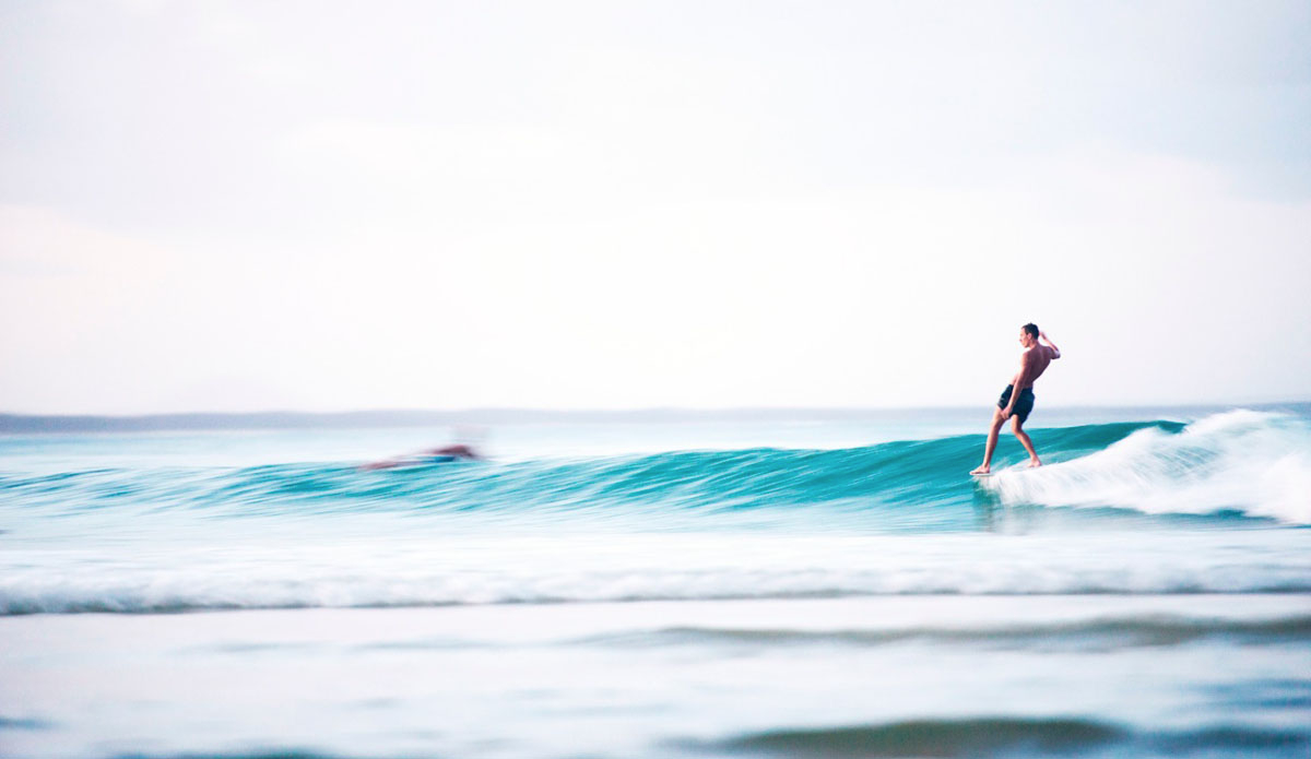 Cyclone Marcia left-overs keeping loggers happy at Noosa. As night time was approaching, surfers still slid down the line. I slowed the shutter right down and captured this relaxed surfer cruising his way along first point, scoring the remaining lumps of Marcia. Photo: <a href=\"https://www.kanebrownphoto.com/#1\">Kane Brown</a>
