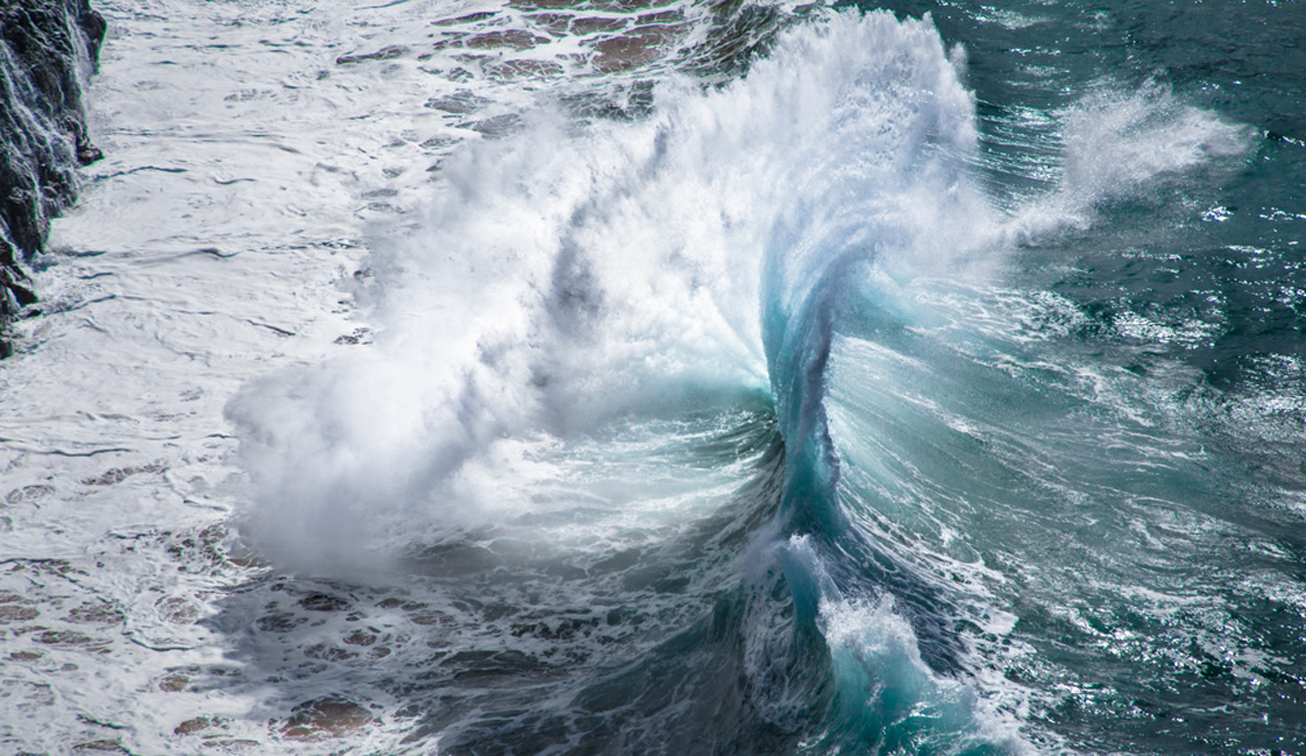 Backwash explosion off three-thousand-feet sea cliffs.