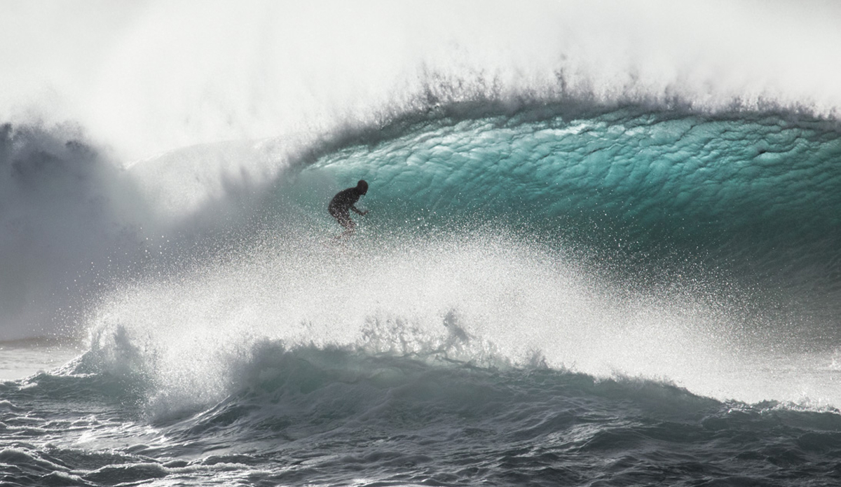 A surfer cruising in the blue room.