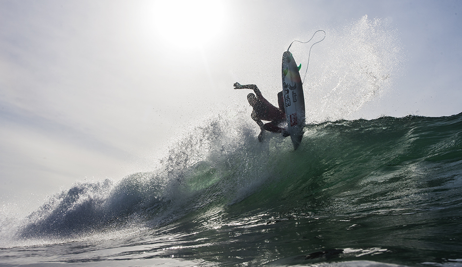 Before Quiksilver dropped the ball, Raph used to have a crew of team riders come for boat trips. Balaram Stack loving the empty line ups in his hooded suit. Photo: <a href=\"https://www.kylervos.com/index2.php#!/Home\">Kyler Vos</a>