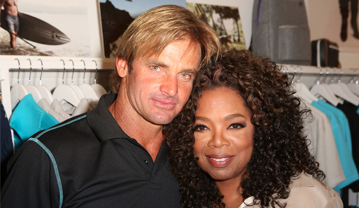 Laird Hamilton cozies up to Oprah Winfrey. (Photo by Ari Perilstein/Getty Images for Laird Apparel LLC)