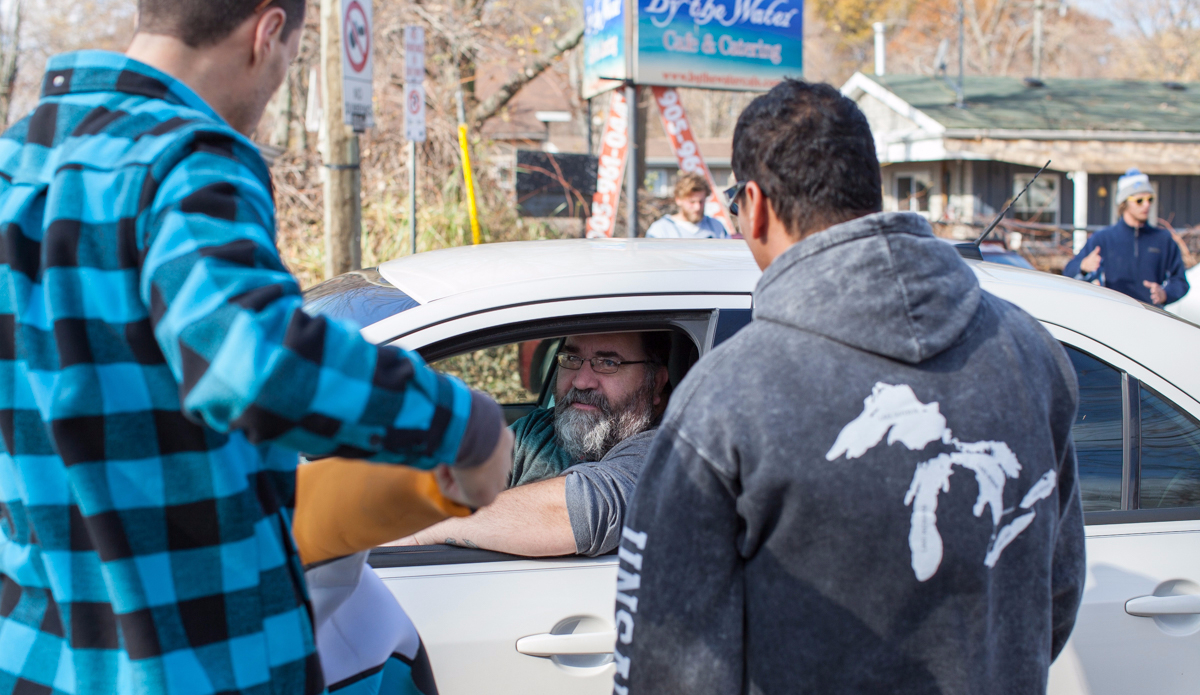 Pre-surf parking lot gathering. Photo: Lucas Murnaghan