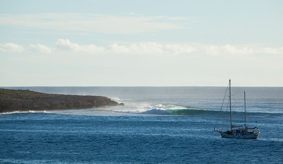 The view from our camp site in Gnarloo. The Bluff doing its thing and a very lucky crew on this boat. North West Australia. Photo: <a href=\"https://www.reposarphoto.com\">Jason Reposar</a>