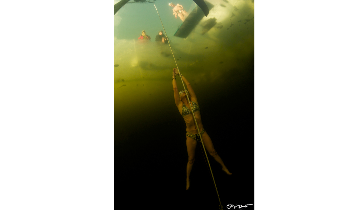 Freediver Tomoka Fukuda doing a no-ﬁns dive under ice. Photo: <a href=\"https://liabarrettphotography.com/\" target=_blank>Lia Barrett</a>