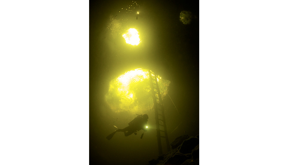 Ascending from a dive at the entrance of Calavera Green light cenote. Photo: <a href=\"https://liabarrettphotography.com/\" target=_blank>Lia Barrett</a>