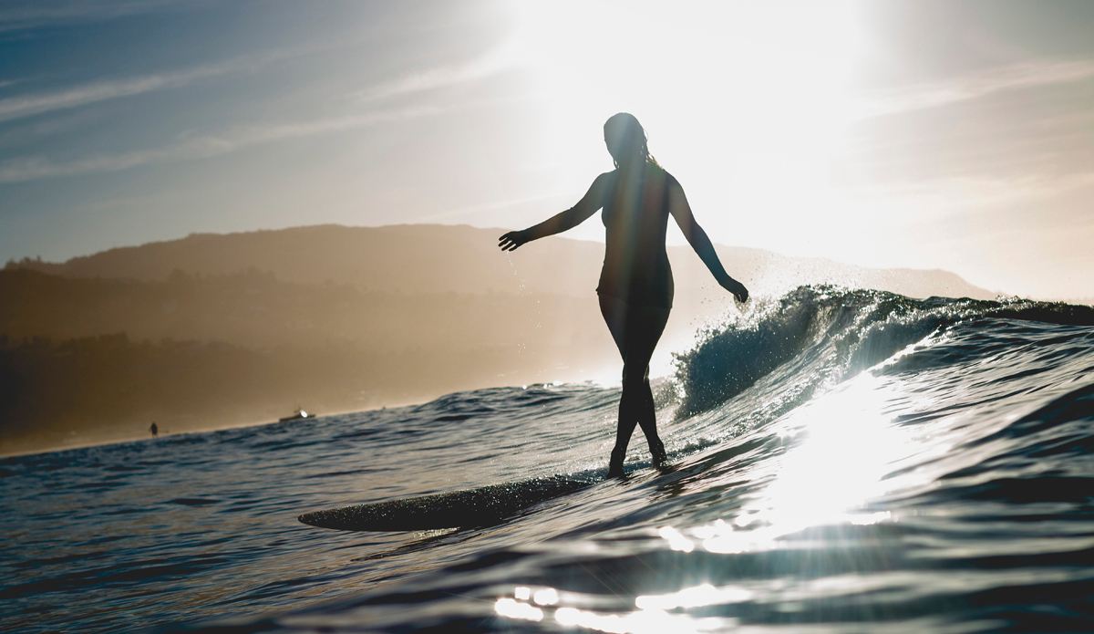 Anna Ehrgott (@annaehrgott), of Sage Brush Bags (@sagebrushbags), cross stepping under first light. It was not long after I followed Anna on Instagram that I respected her refreshing style of surfing, photography, and outlook on life. After briefly speaking to her at First Point about the unfortunate Santa Barbara oil incident that occurred a few months ago, I thought it would be epic to shoot some photos. The sunrise this morning was incredible; waves not so much. Regardless, it was an epic time wading in the Pacific as the light slowly crept above the hillside. Photo: <a href=\"https://instagram.com/corygehr\">@CoryGehr</a>