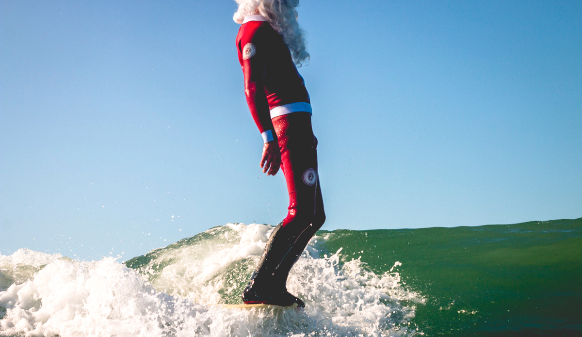 Shane Jones of Jonesea Wetsuits (@jonesea) hanging “tensil.” 
Jonesea is a one-of-a-kind wetsuit entrepreneur and artist. I was fortunate enough to become his team photographer last year and I couldn\'t be any more stoked on the custom suits he has provided me. He called me one afternoon and excitedly explained to me how he made a Santa Clause wetsuit and we needed to shoot with it ASAP. This timeless shot, alongside a few others, resulted from this session, which will remain in my memory forever. It was probably the most fun I’ve ever had at Blackies—especially since nobody wanted to snake Santa. Photo: <a href=\"https://instagram.com/corygehr\">@CoryGehr</a>