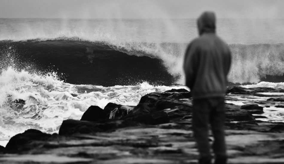 Surfer contemplating whether it’s worth it to run back to the truck and put on the 5 mil. Photo: <a href=\"https://jerseyshoreimages.com/about.html\">Robert Siliato</a>
