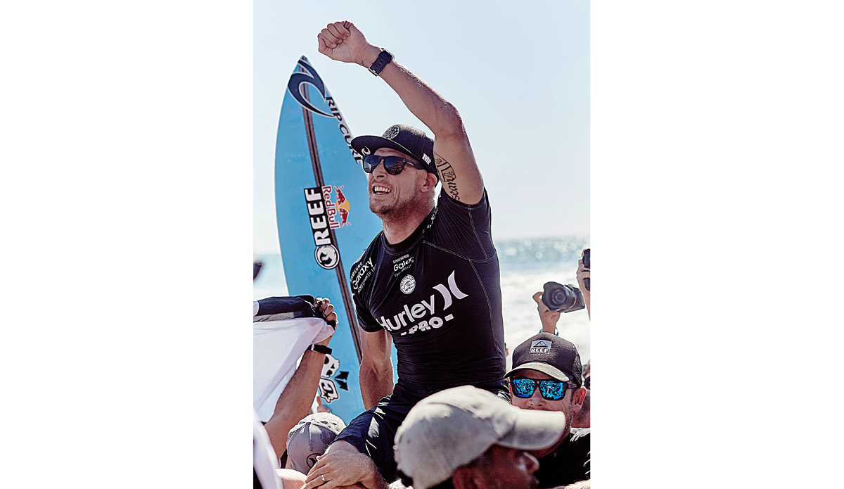 Hurley Pro champ, Mick Fanning, hoisted and carried to the winner\'s podium. Photo: <a href=\"https://santiagobisso.com\">Santiago Bisso</a>