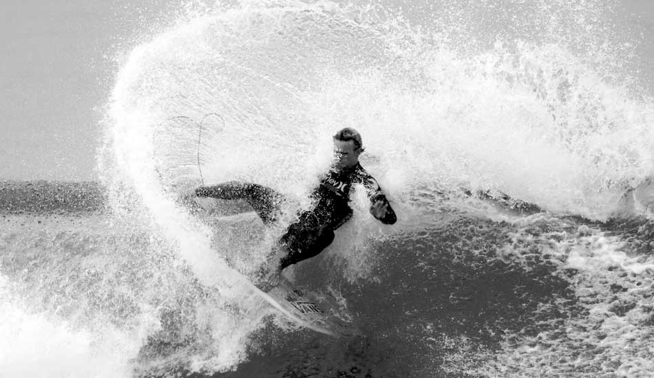 Pat Gudauskas moving some water on a massive layback blow-tail in the early morning of Round 1 of the 2013 Hurley Pro. Photo: <a href=\"https://www.driftwoodfoto.com/\">Benjamin Ginsberg</a>