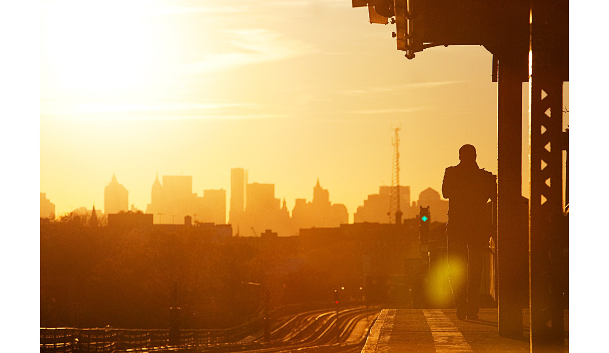 The morning calm before the bustling crowds clamor into the city. Queens, New York. This was my first time in NYC, and I was passing through from Puerto Rico after a surf trip. It was quite a contrast in lifestyle. I too was awaiting a train to venture into the city. Photo: <a href=\"https://www.luciagriggi.com\" target=\"_blank\">Lucia Griggi</a>