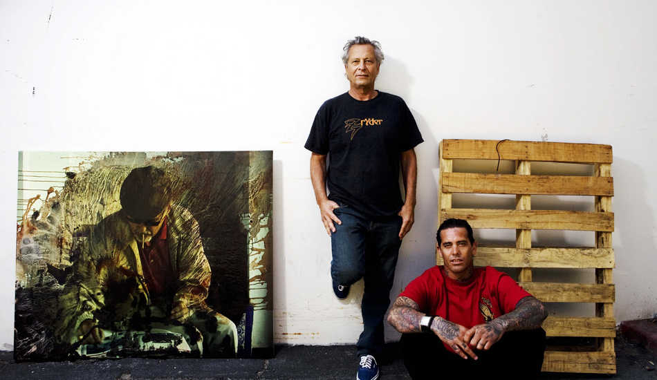 HERBIE and CHRISTIAN FLETCHER, Orange County, CA. 
Photographed in Herbie\'s studio (next to Herbie\'s painting of Dennis Hopper) in the summer of 2009. Christian used skating moves to inspire his surfing. Herbie used skateboarding moves to mimic surfing moves in the 1960\'s. Photo: <a href=\"https://www.luciagriggi.com\" target=\"_blank\">Lucia Griggi</a>