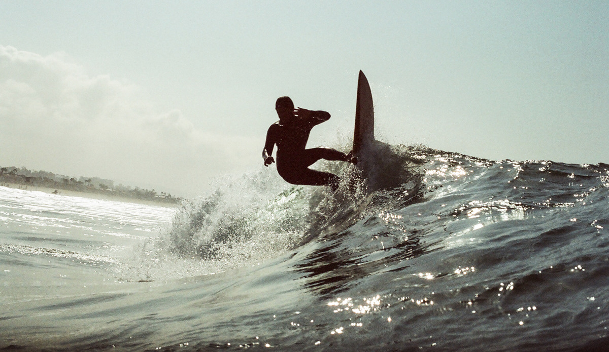 Trevor Oosterhof on a small, fun winter day in Newport Beach.  This was taken with a 35mm film camera in an old dive housing.