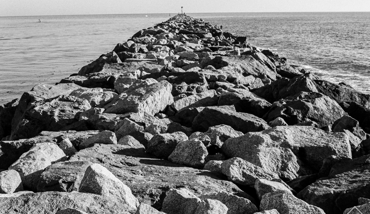 Protecting the Newport Harbor from the open ocean, this man-made jetty created one of the worlds most celebrated close-out waves - The Wedge.
