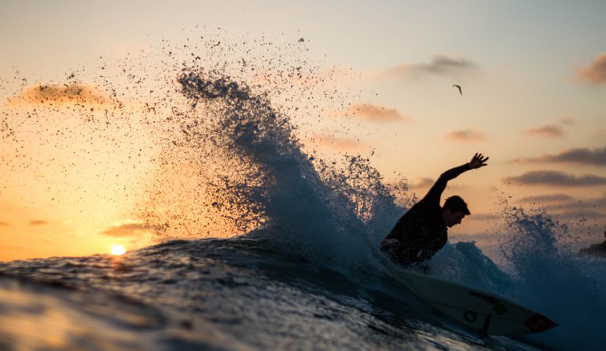 Chase Newsom spraying some water around during a nice, warm summer sunset.