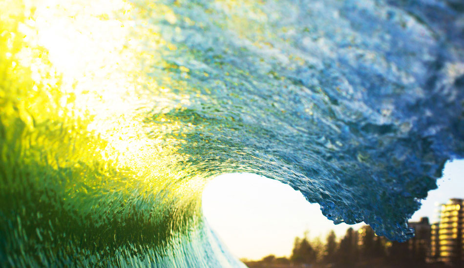 I was shooting some stuff for an Australian tourism board and the hotel I was in overlooked these little 2ft slabs, so I planned on getting up early to go have a little frolic in the shorey. The next morning, there wasn\'t a breath of wind and the little slabs were throwing over wider than they were high. The sun was rising directly through the lip line, offering a very patriotic green and gold palette. Photo: <a href=\"https://www.lukeshadbolt.com/\">Luke Shadbolt</a>