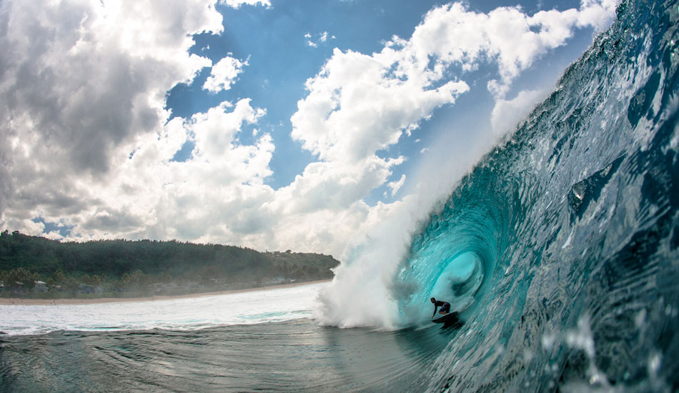 Dusty Payne setting up for the inside shelf at Pipe. He\'d come in from second reef with a long, drawn out bottom then just hooked right under the lip as the wave stood up and heaved. So casual. One of the most rewarding days shooting from the water at Pipe I\'ve had. Photo: <a href=\"https://www.lukeshadbolt.com/\">Luke Shadbolt</a>
