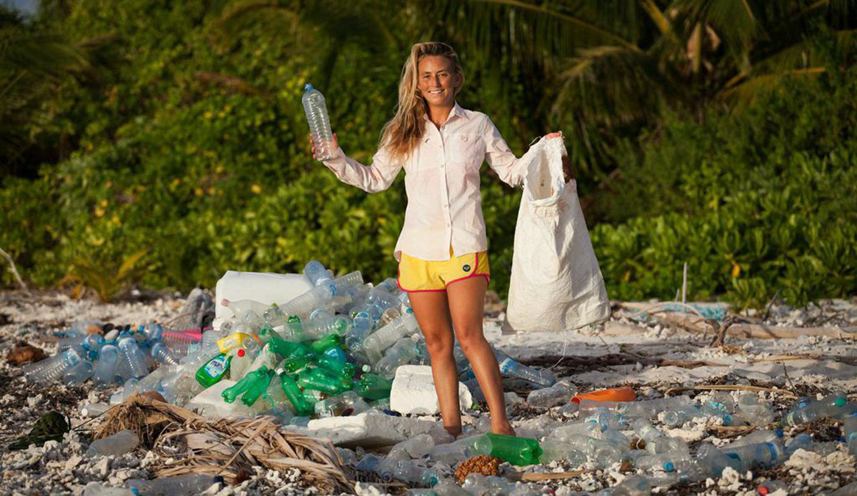 I returned to this small island where I survived Discovery Channel’s \"Naked and Afraid.\" The pile of plastic behind me took only 10 minutes to clean up from about 50 feet of beach. These bottles drifted from all over the world. The Roxy board shorts I\'m wearing here were made out of 6 recycled plastic bottles. Photo: <a href=http://www.vivantvie.com/\">Sarah Lee</a>
