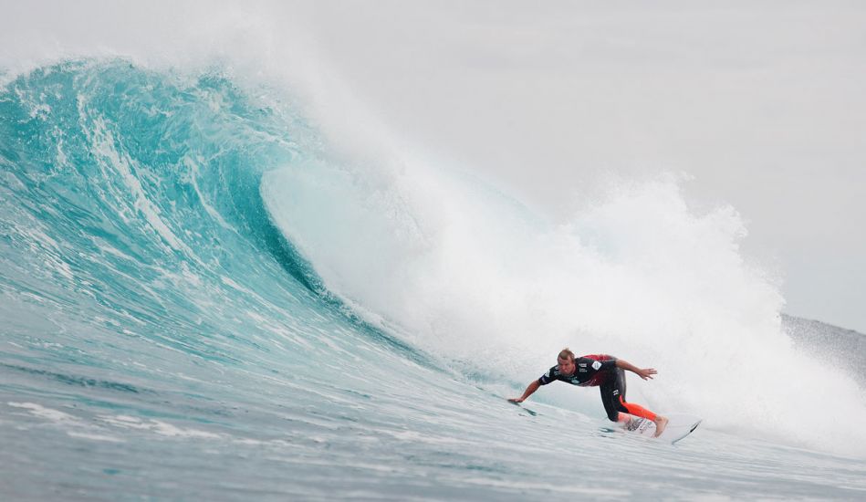 Taj Burrow\'s classic bottom turn. Photo: <a href=\"https://www.aspworldtour.com/\">ASP/Cestari</a>