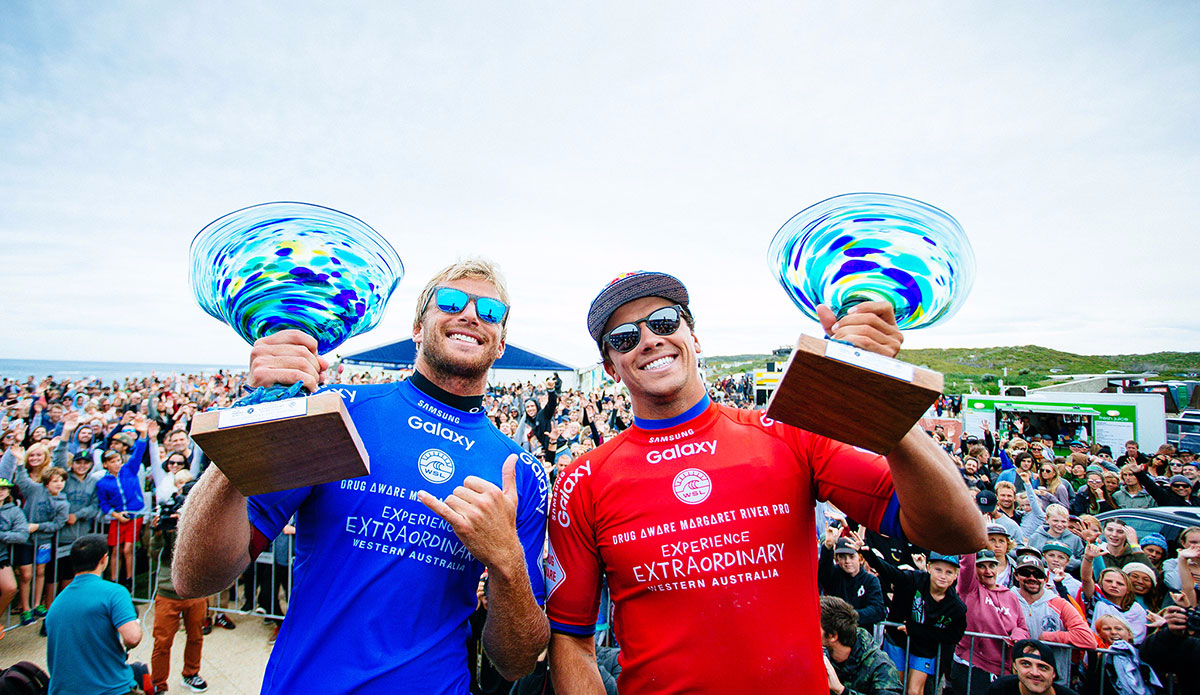 Winner Sebastian Zietz of Hawaii (pictured blue) and runner up Julian Wilson of Australia (red) hold their trophies during prizegiving at the Drug Aware Margaret River Pro in Western Australia on Saturday April 16, 2016. Photo: <a href=\"https://www.worldsurfleague.com/\">WSL</a>/<a href=\"https://www.instagram.com/edsloanephoto/\">Ed Sloane</a>