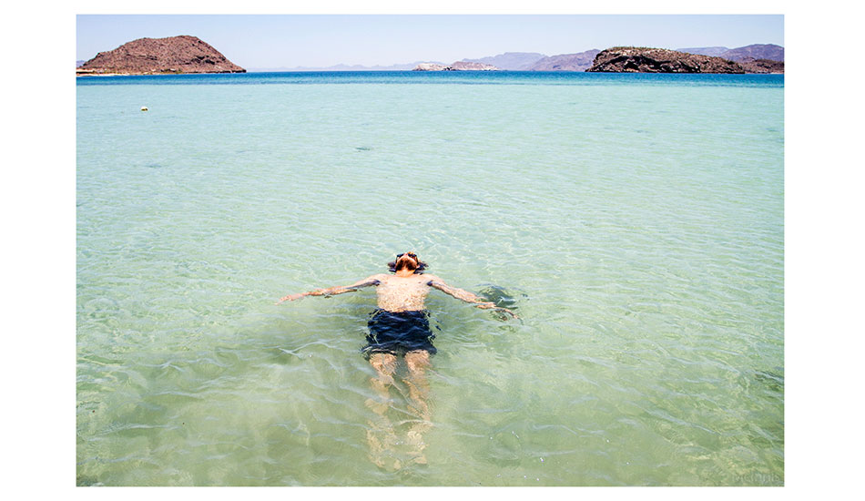 Dane relaxes, all surfed out. Photo: <a href=\"https://markmcinnis.com/\">Mark McInnis</a>