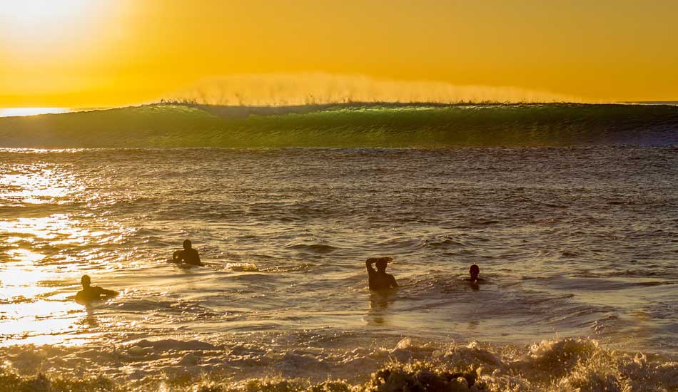 Kids stop and marvel at an outside set wave at Marine Street. Photo: <a href=\"https://www.mattadenphotography.com\">Matt Aden</a>