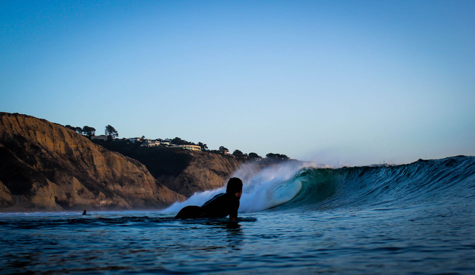 A surfer enjoys the view at Blacks. Photo: <a href=\"https://www.mattadenphotography.com\">Matt Aden</a>