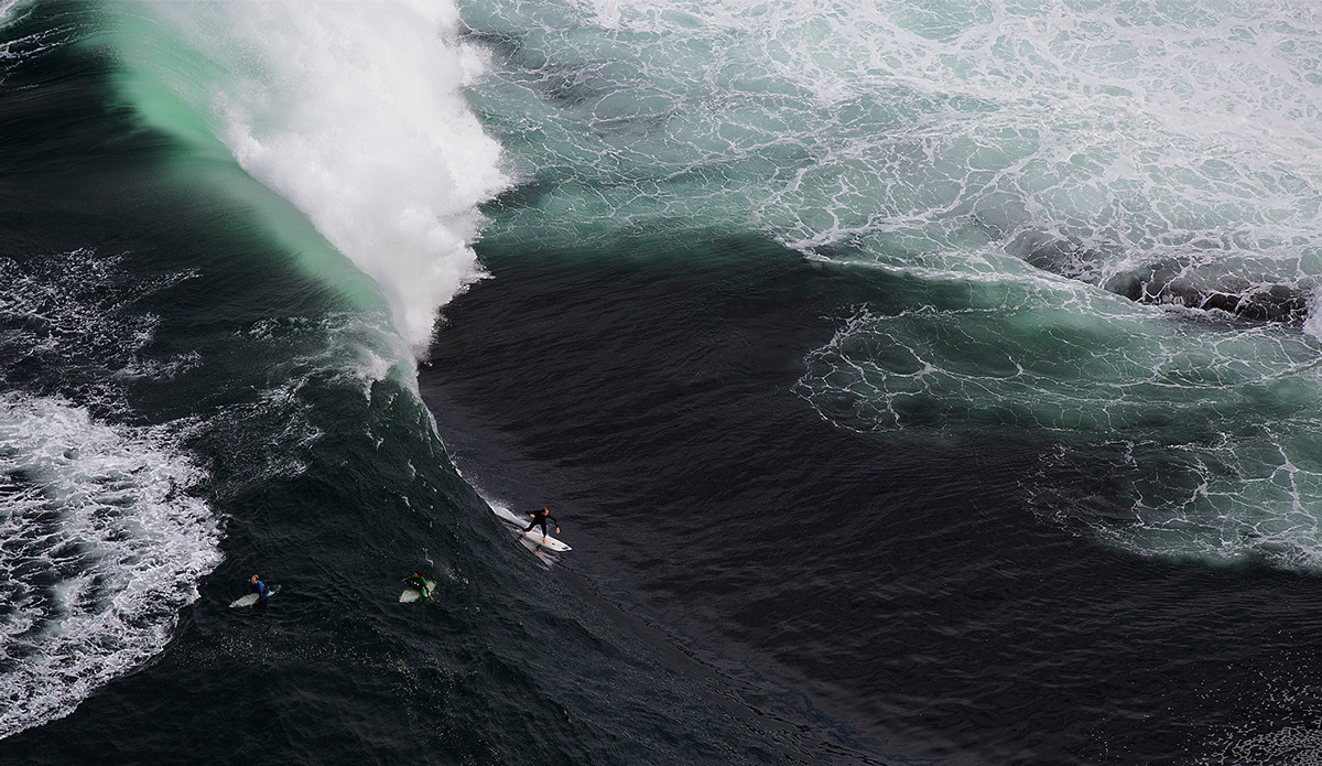 Here is Chris Ross on a bomb, you kind of lose perspective of the size of the wave from the chopper angle, but that is a nugget. Photo: <a href=\"https://www.facebook.com/pages/MattDunbarPhotography/285105918215175\">Matt Dunbar</a> and  <a href=\"https://www.ianbirdphotography.com/\">Ian Bird</a>