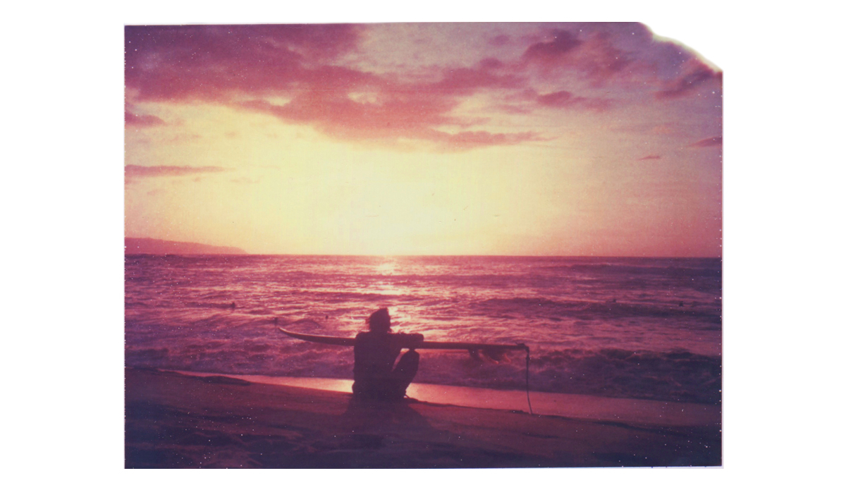 Surfer sunset in Hawaii.