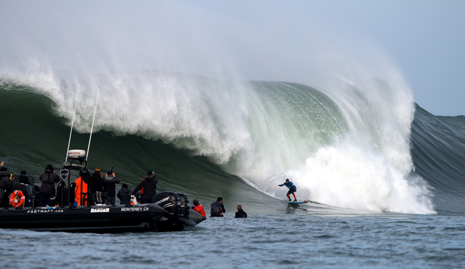 2013 champion Peter Mel outruns a bomb to start off his 2014 Maverick\'s Invitational in Half Moon Bay, California. Photo: <a href=\"https://www.driftwoodfoto.com/\">Benjamin Ginsberg</a>