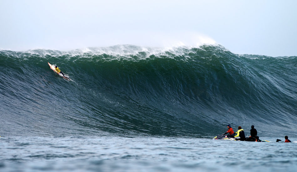 Ryan Seelbach paddles over a massive set wave at the 2014 Maverick\'s Invitational in Half Moon Bay, California. Photo: <a href=\"https://www.driftwoodfoto.com/\">Benjamin Ginsberg</a>