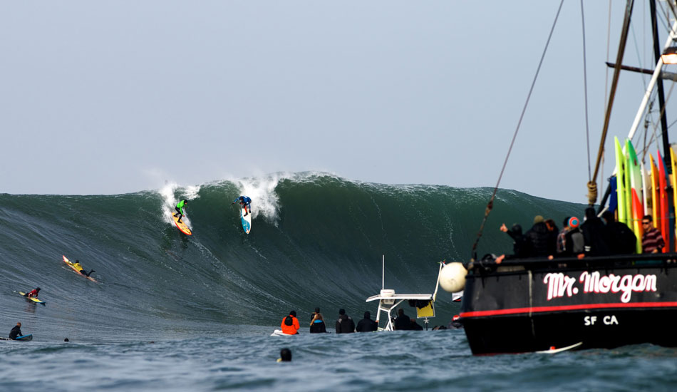 Peter Mel and Danilo Couto share a set wave at the 2014 Maverick\'s Invitational in Half Moon Bay, California. Photo: <a href=\"https://www.driftwoodfoto.com/\">Benjamin Ginsberg</a>