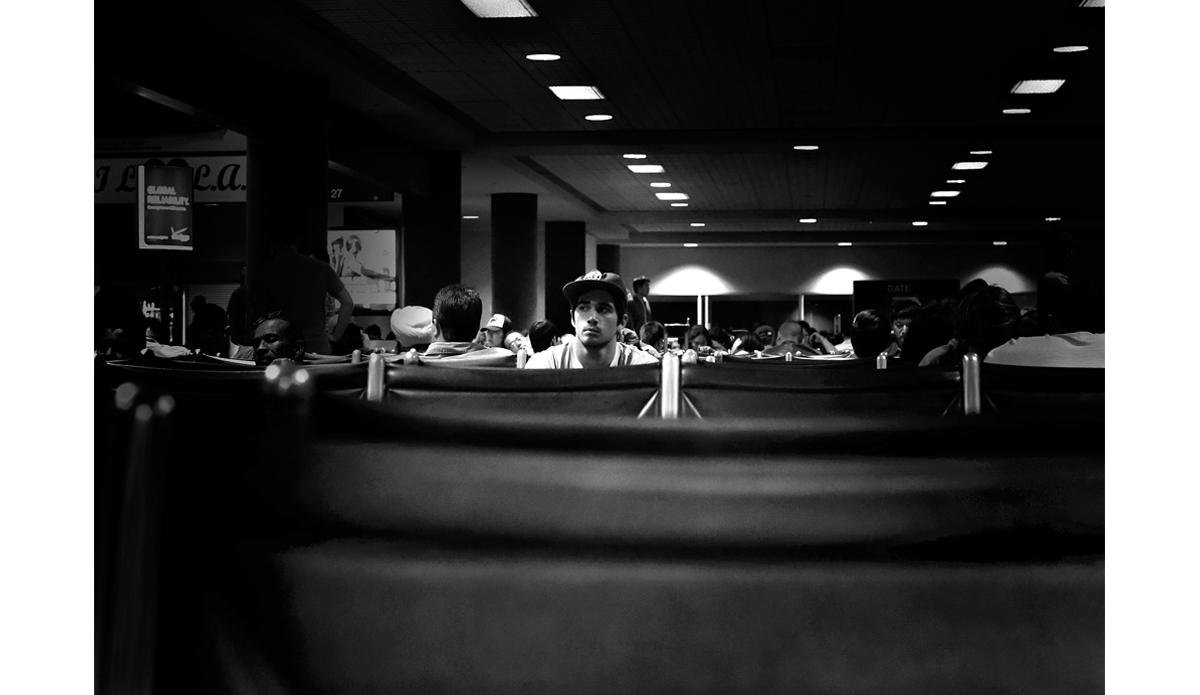 Connor Edmonds eyeing the crowd at LAX before the boarding chaos commenced. Photo: <a href=\"https://www.maxxbuchanan.com/\">Maxx Buchanan</a>