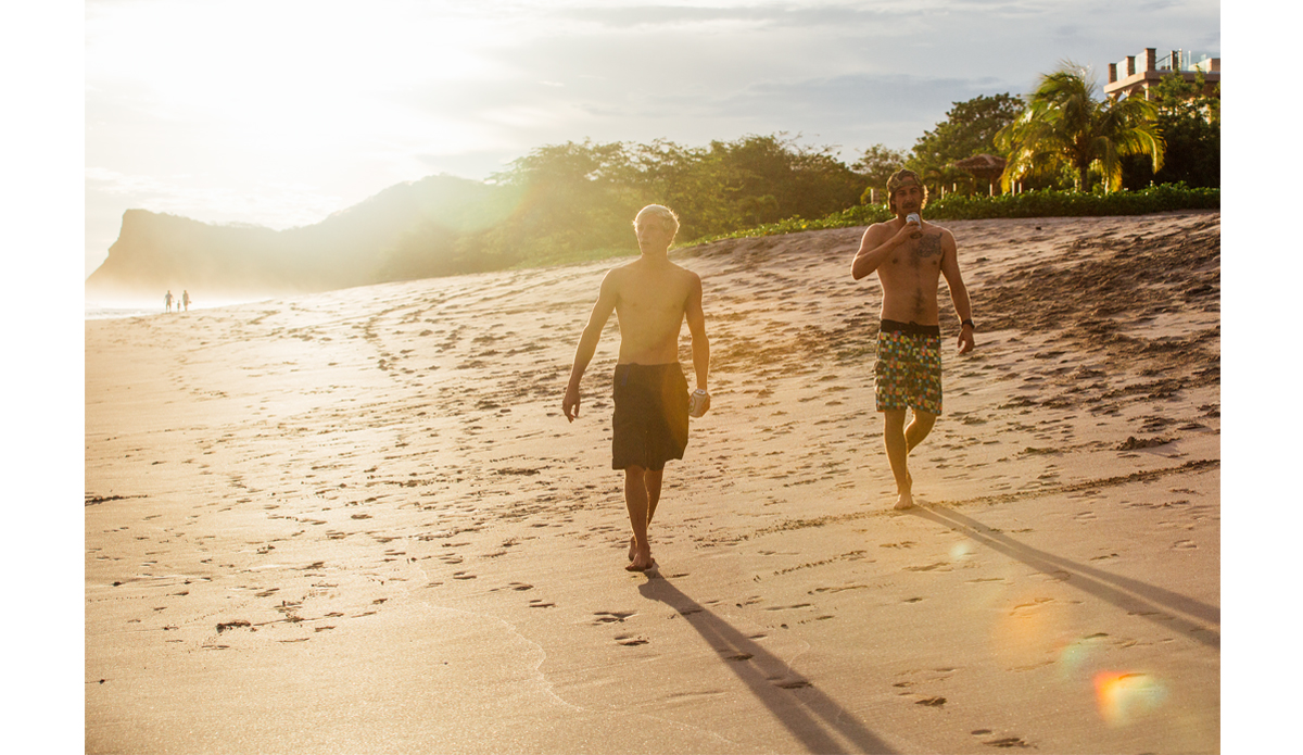 Peter Smith and Fletcher Sams staying hydrated while out for a sunset surf check.  Photo: <a href=\"https://www.maxxbuchanan.com/\">Maxx Buchanan</a>