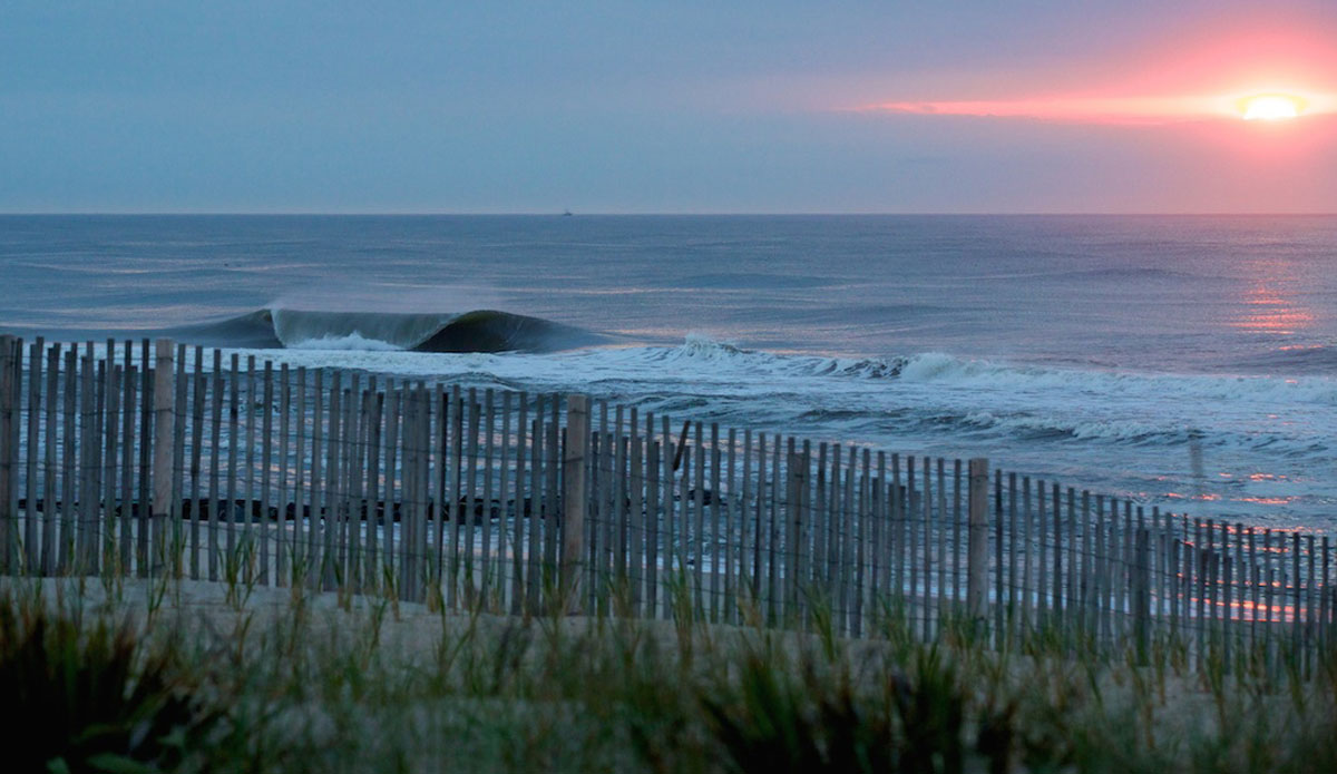 This was a magical morning on LBI early June.  This is the photo that won the user-submitted monthly photo contest on Surfline earlier this year and I was super stoked this sunrise lined up with wave. When I showed up it was still dark, which gave me time to set up for this sunrise, while a-frames unloaded up and down the beach. Photo: <a href=\"https://www.mgvphotography.com/\">Michael Vericker</a>