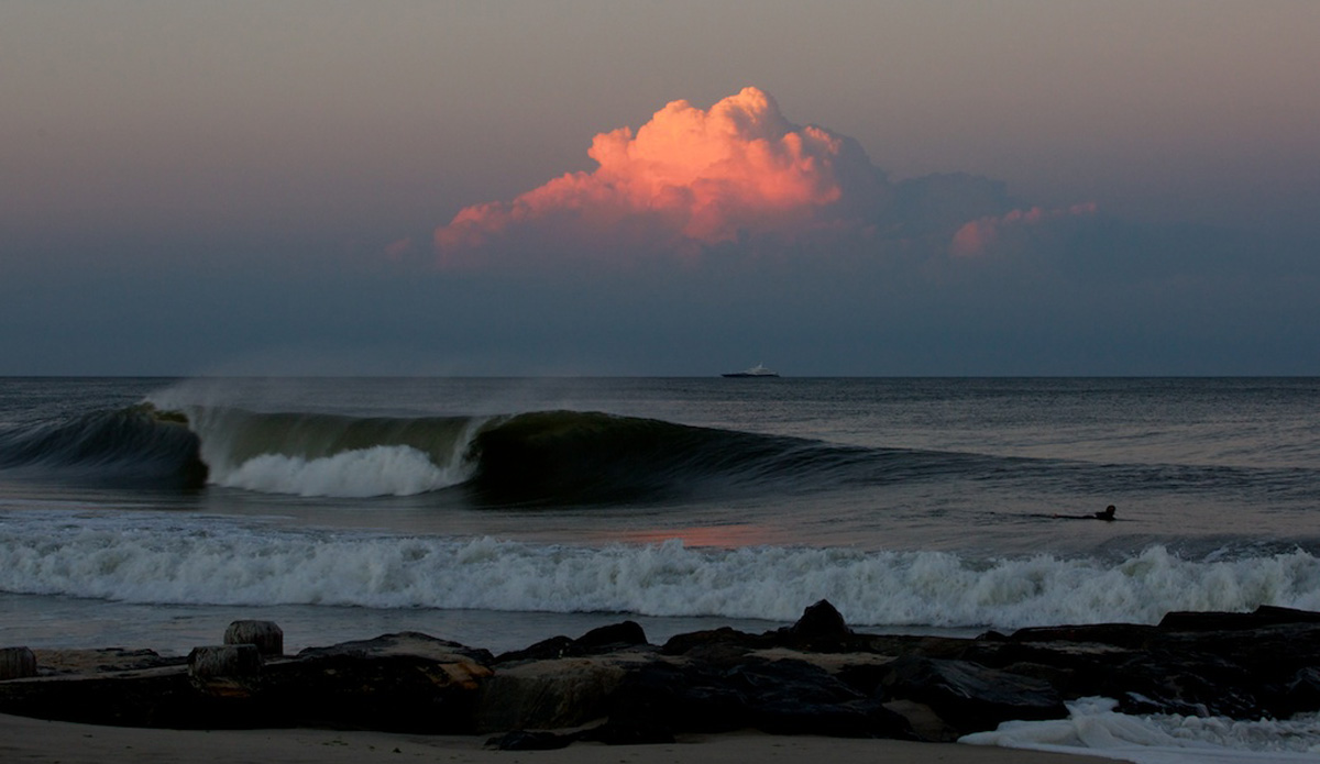 This shot was taken on the evening of August 13th, 2014, which has come be known as \"The Day,\" in New Jersey.  I was baffled by this cloud because I kept seeing what I thought was lightning but wasn\'t completely sure.  I was in that \"spent-all-day-in-the-ocean\" state of mind, which can sometimes play tricks on your vision, but I knew I had to grab a photo of the cloud and one if the many waves still coming though. Photo: <a href=\"https://www.mgvphotography.com/\">Michael Vericker</a>