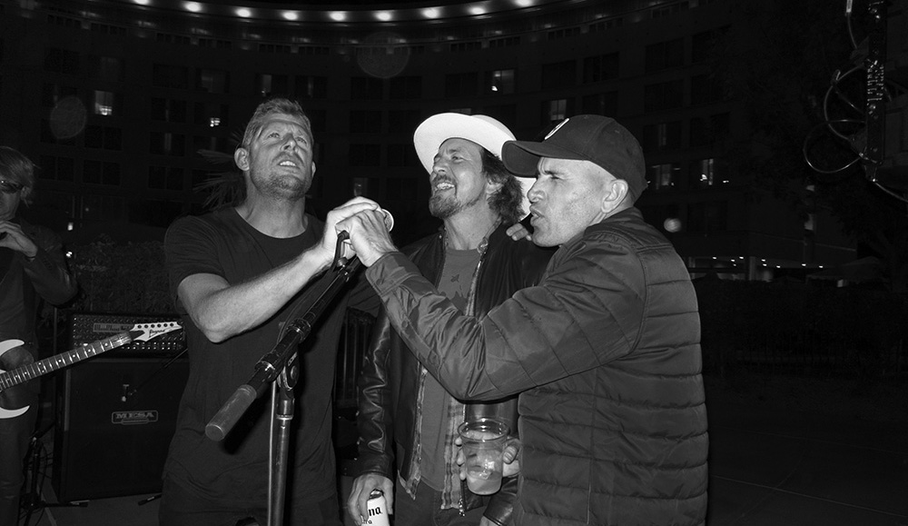 \"This is up at Lemoore. There was this \'80s band that was really good, so Kelly and Mick went up and were singing background vocals. I had never seen Mick get up on stage and sing, and that\'s those three guys pounding away at back up vocals. Any time is a good time with Mick.\" Photo: <a href=\"https://t-sherms.com/\" target=\"_blank\">Steve Sherman</a>