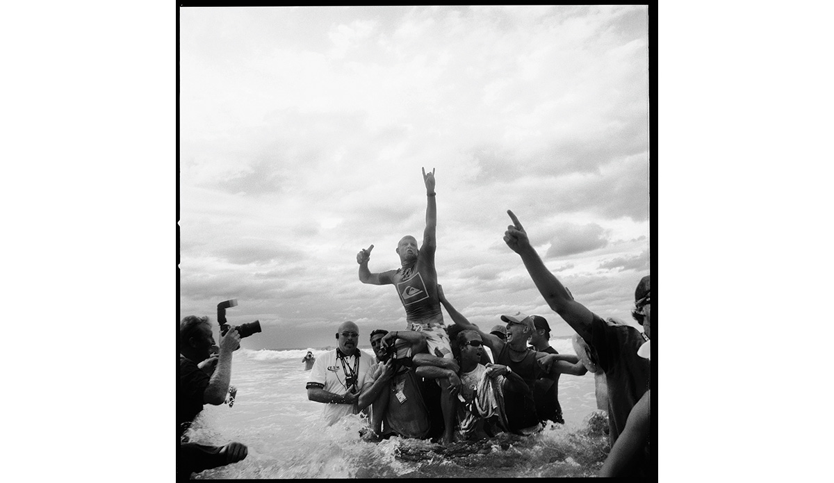 \"That\'s when he won Snapper after coming back from his horrible leg injury. It was a really triumphant moment. Woody, his buddy next to him, he was the WSL security guy who hung himself a few years ago. Woody was a good friend to us all, and I jus love that he was on that photo.\" Photo: <a href=\"https://t-sherms.com/\" target=\"_blank\">Steve Sherman</a>