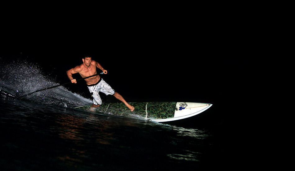 Kamalei is one of my favorite althetes to shoot. He has a lot of talent and heart. I have probably shot him more than anybody else. Channel Island Surfboards sent him some SUPs and we had fun goofing around in the dark. Hardest part is getting the focus to catch. I shot it on another SUP without a water housing, but use a pelican case. On-camera flash shot at 1/200@f5.6 ISO 200. Photo: <a href=\"http://www.mikecoots.com\">Mike Coots</a>